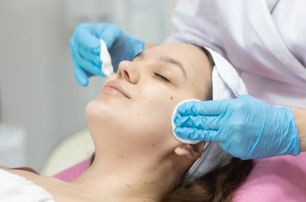 istock Woman is getting her face cleaned with a cloth. 2197253272