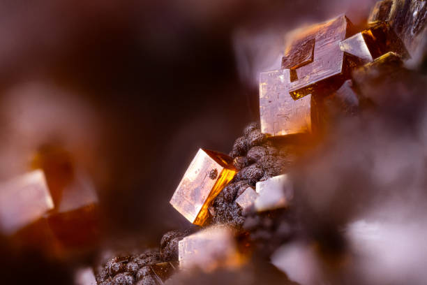 istock Bariopharmacosiderite orange crystal, on goethite balls. Specimen from Clara mine, Oberwolfach, Germany 2197256029
