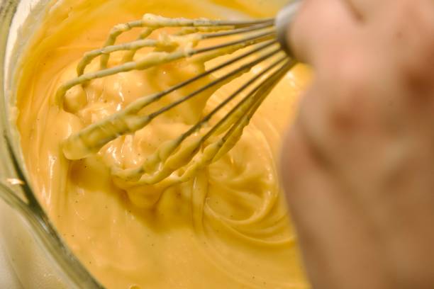 istock Whisking homemade custard in a pot 2197257861