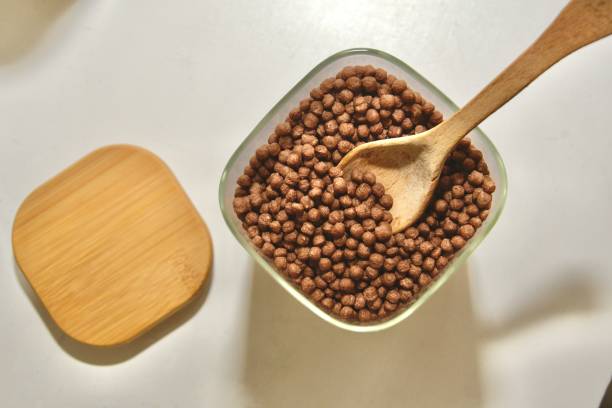 istock Protein cereal jar with a wooden spoon inside 2197257929