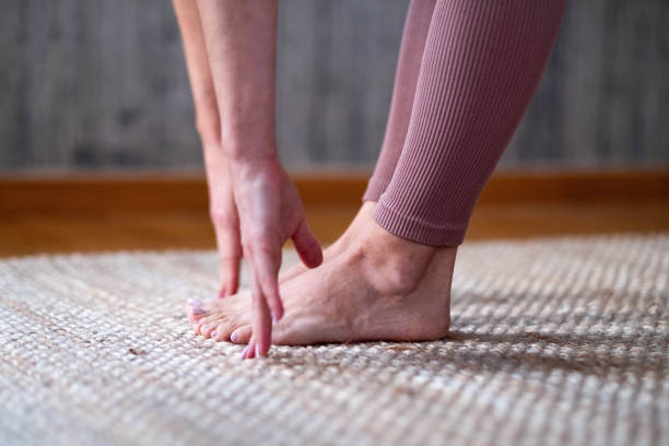 istock close up of woman's legs and hands touching her legs 2197259146