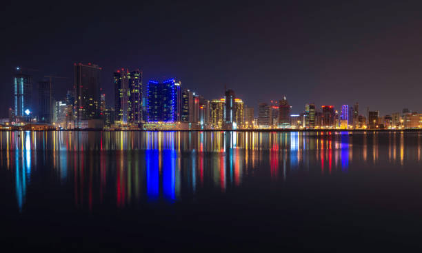 istock Vibrant City Skyline Reflections at Night 2197259456