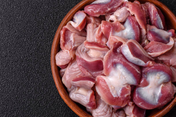 istock Raw chicken or turkey gizzards with salt, spices and herbs 2197261215