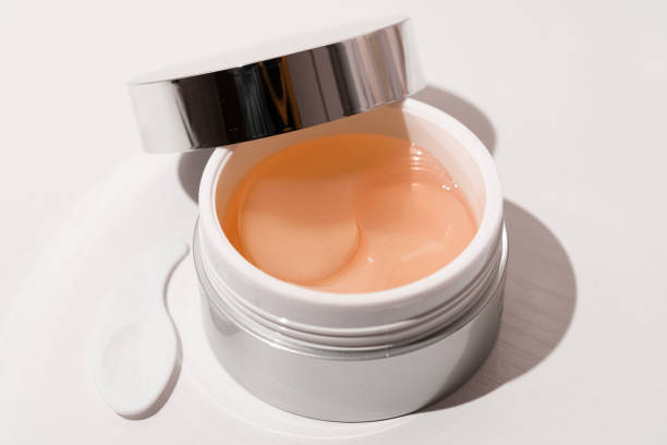 istock Antiaging eye patches with the snail extract lying on a white background 2197261541