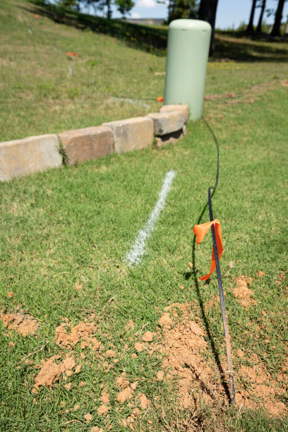 istock New Residential Fiber Optic Cable Line Wire Drop With Orange Flags Across A Yard 2197265383