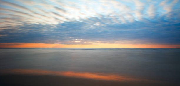 istock Beautiful Calm Sunset over Beach with Calm Ocean. Light Blue Water. Panoramic Seascape 2197267287