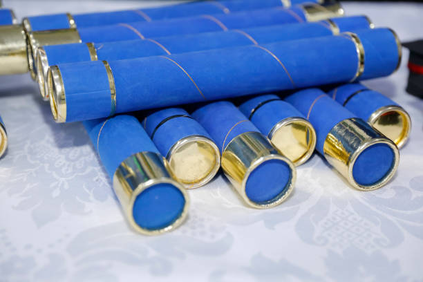 istock education. blue tubes alluding to graduation ceremony 2197267437