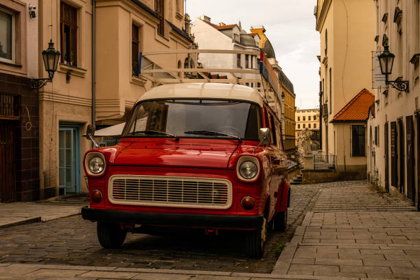 istock Red retro car on the old streets 2197268898