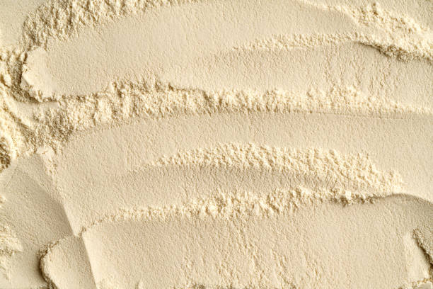 istock Background made of whey protein powder, top view 2197271507