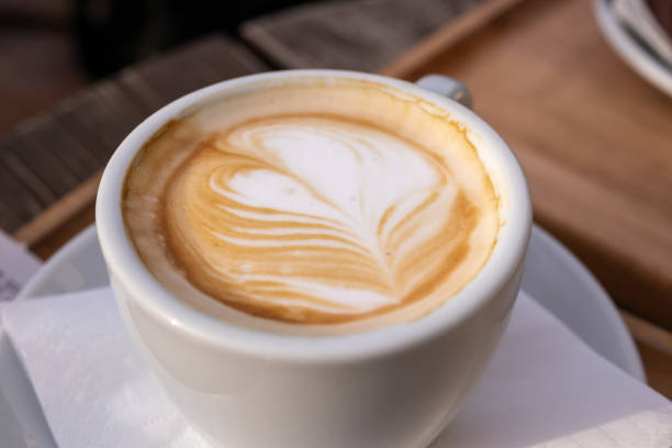 istock Elegant Cappuccino with Latte Art in White Cup 2197273040