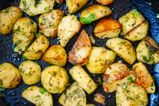 istock Roasted herb potatoes background. Fried potatoes country style 2197273272