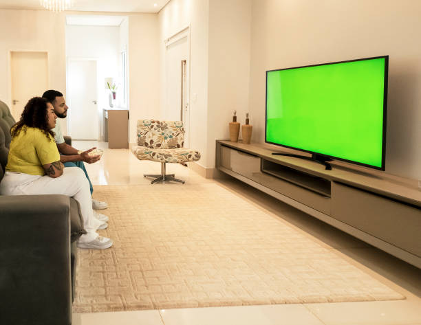 istock Couple watching TV at home 2197277145