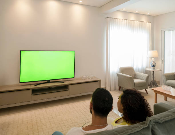 istock Couple watching TV at home 2197277265