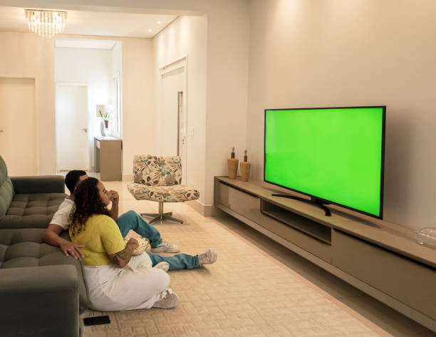 istock Couple watching TV at home 2197278071