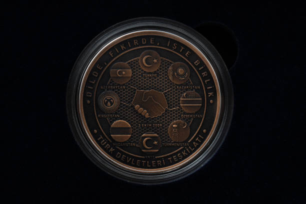 Bronze Commemorative Coin, Turkish States Organization isolated on white. This bronze coin was printed by the mint of the Republic of Turkey. (Turkish: Turk Devletleri Teskilati).