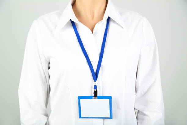 istock Businesswoman with blue blank badge 2197282381