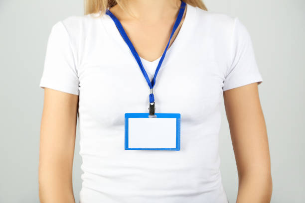 istock Businesswoman with blue blank badge 2197283165