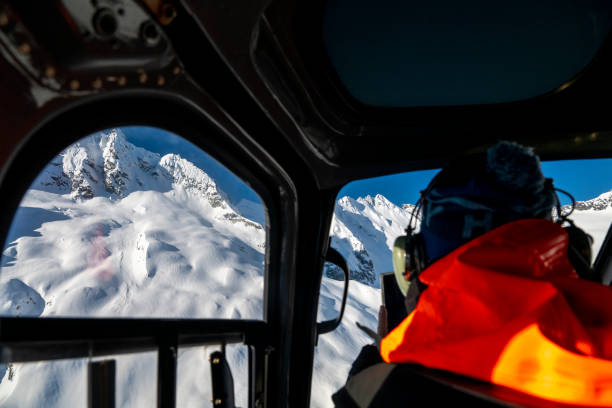 istock View past backcountry skier in helicopter above mountains 2197283855