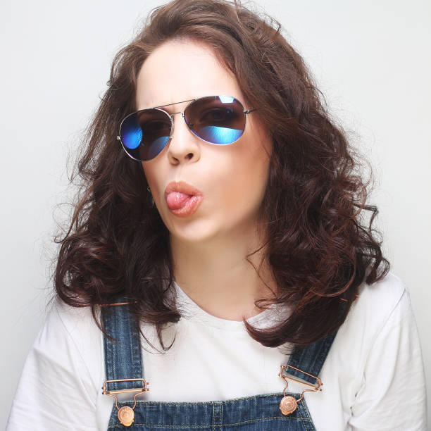 istock Young surprised woman wearing sunglasses. 2197289497