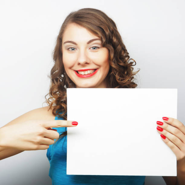 istock Woman holding blank card 2197293168