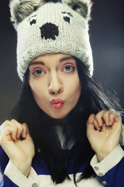 istock young woman in funny winter hat 2197296658