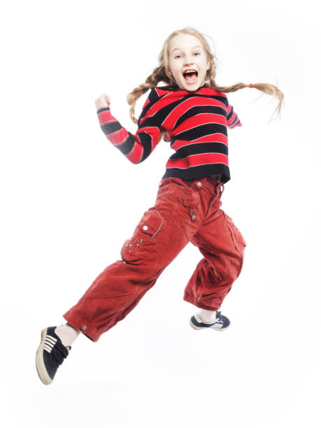 istock girl jumps on a white background 2197299989