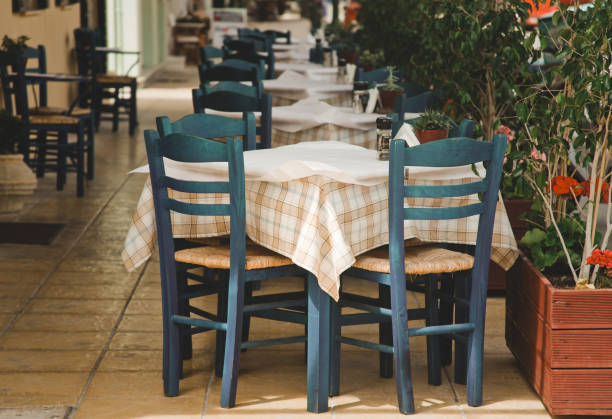 istock Blue chairs on a greek cafe 2197300271
