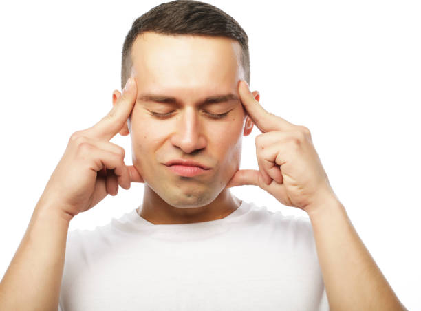 istock Attractive young man suffering of strong headache 2197301463