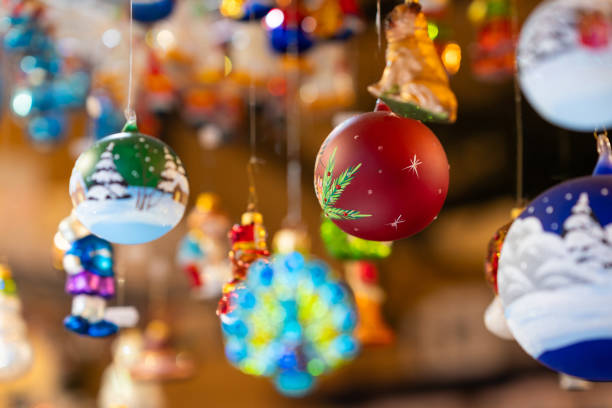 istock Hand-Painted Christmas Ornaments Hanging in Market 2197301506