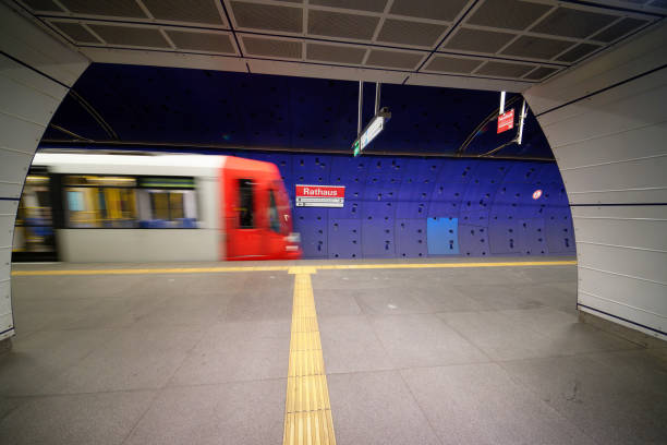 Cologne, Germany January 31 2025: a kvb train enters the rathaus subway station in cologne with motion blur