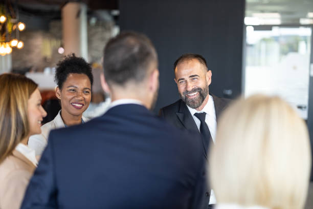 istock Group of Professionals Enjoying Conversation Over Meeting 2197308423
