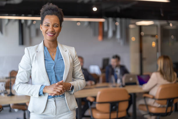 istock Joyful Woman Smiling in Corporate Environment 2197308438