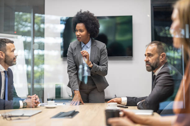 istock Confident Female Speaker Leading Engaging Team Discussion 2197308457