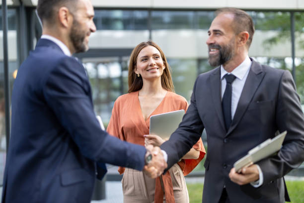 istock Professional Handshake Among Three Business Associates 2197308495