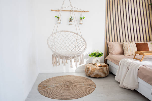 istock Cozy indoor space featuring a hanging chair and minimalist decor 2197308540