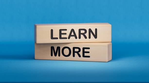 istock Learn more symbol. Concept word Learn more on wooden blocks.Business and Learn more concept. Wooden cube blocks. Copy space.3D rendering on blue background. 2197308652