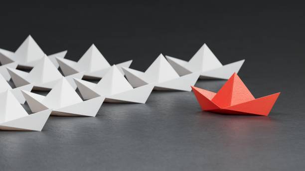 istock Business concept for new ideas creativity, innovative solution and Leaderboat concept with black paper boat leading among white.3D rendering on black background. 2197308818