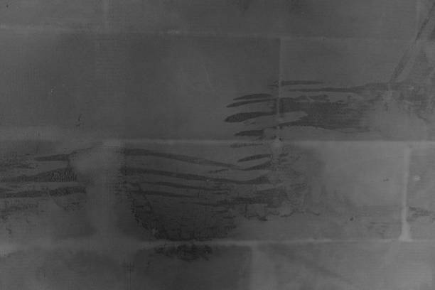 Mysterious markings on a weathered wall in an urban environment