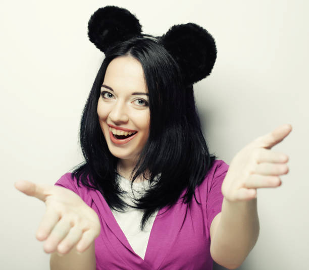 istock Surprised young woman with mouse ears 2197310413