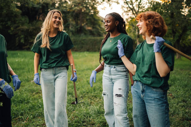 istock Volunteers walking and talking during cleanup in park 2197310663