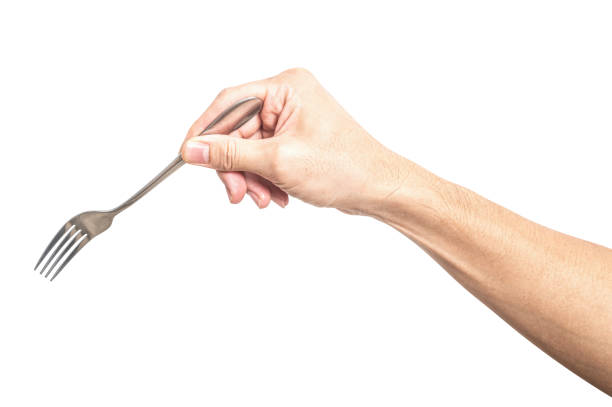 istock Male hand holding a silver steel fork isolated on white background. 2197316036