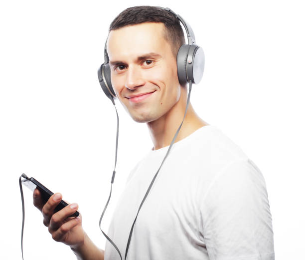 istock life style and people concept:Young man enjoying music on his he 2197320249