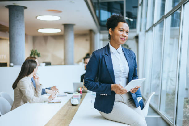 istock Businesswoman with Tablet in Modern Space 2197320450