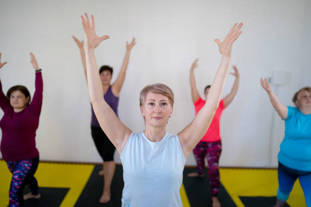 istock Yoga class in upward hand stretch pose 2197321274