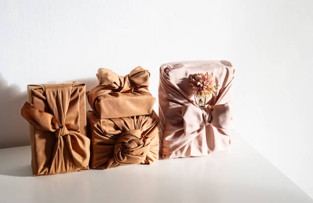 istock Gift boxes wrapped in reusable fabric, promoting waste reduction and sustainable gifting ideas. 2197326464