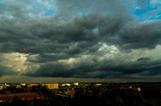 istock Dramatic dark storm rain clouds black sky background. Dark thunderstorm clouds rainny atmosphere. Meteorology danger windstorm disasters climate. Dark cloudscape storm disaster gloomy gray cloud sky 2197331235
