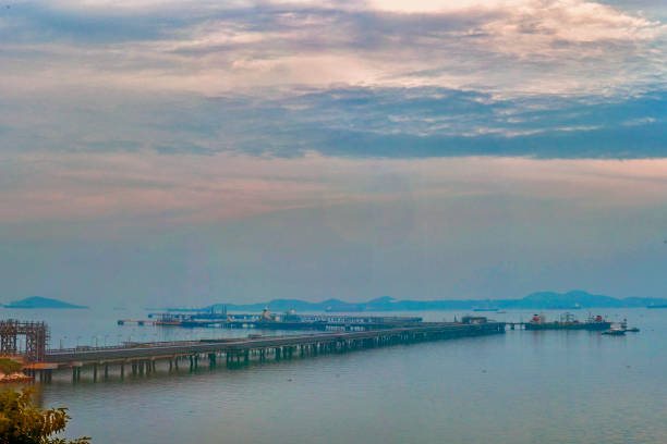 Logistic shipping quay boat Engineering crane depot at logistic export terminal control. Warehouse freight background container yard loading quayside harbor port. Logistics seascape shipping portal