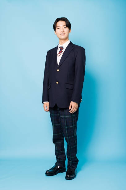 Portrait of Asian teenage boy in high school uniform