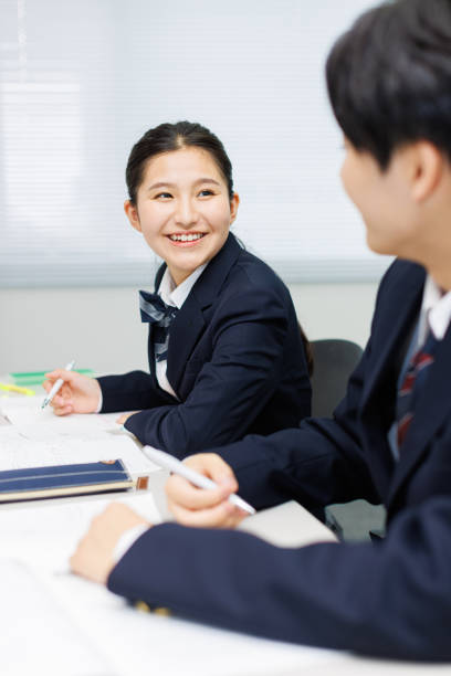 istock Asian teenagers in high school uniform studying in the class 2197332501