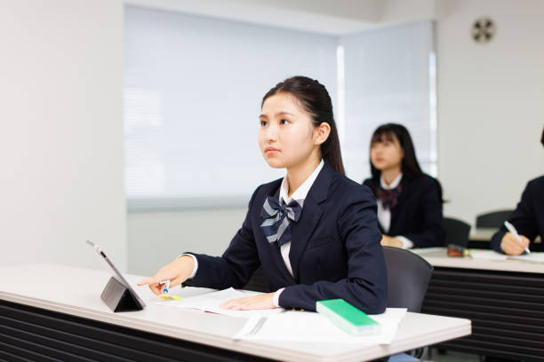 istock Asian teenagers in high school uniform studying in class 2197332527